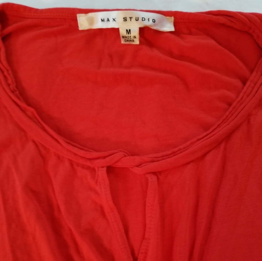 Sleeveless faux wrap peep hole shirt